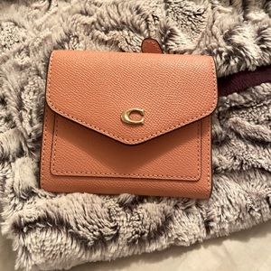 Coach crossgrain leather wallet. New with tags. Light salmon color.